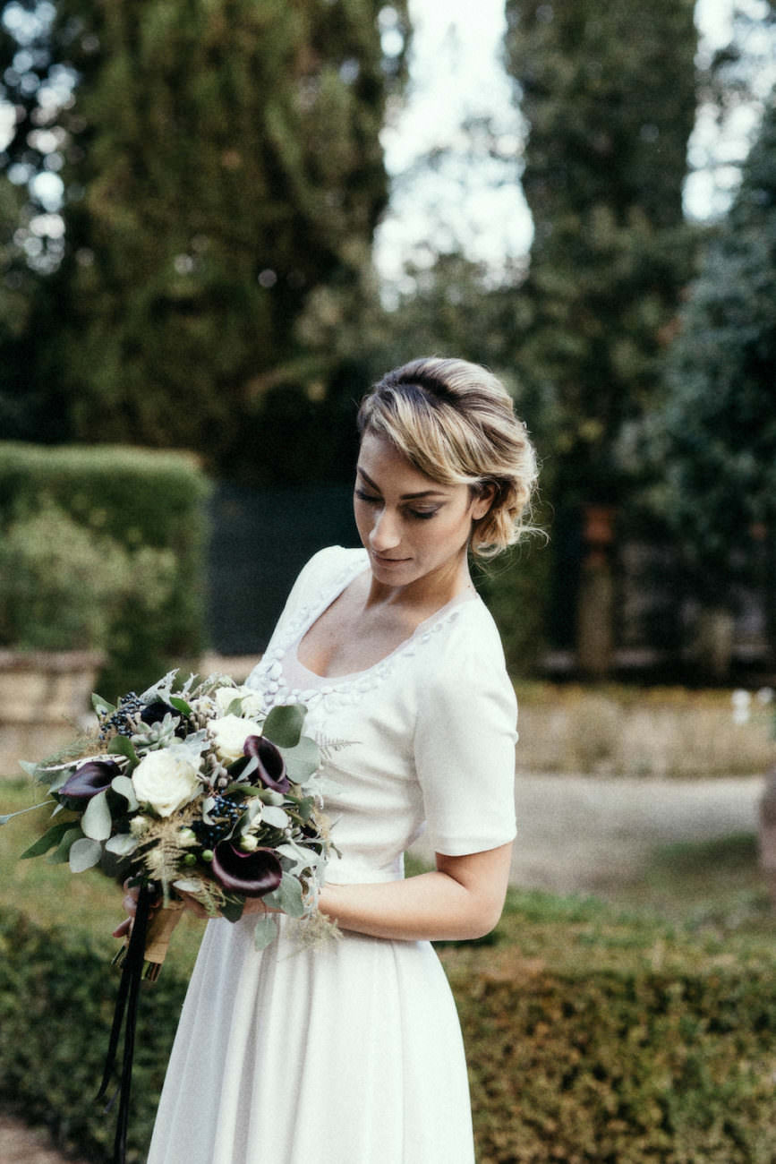 Style Shoot in Tuscany, Italy bride in garden with flowers