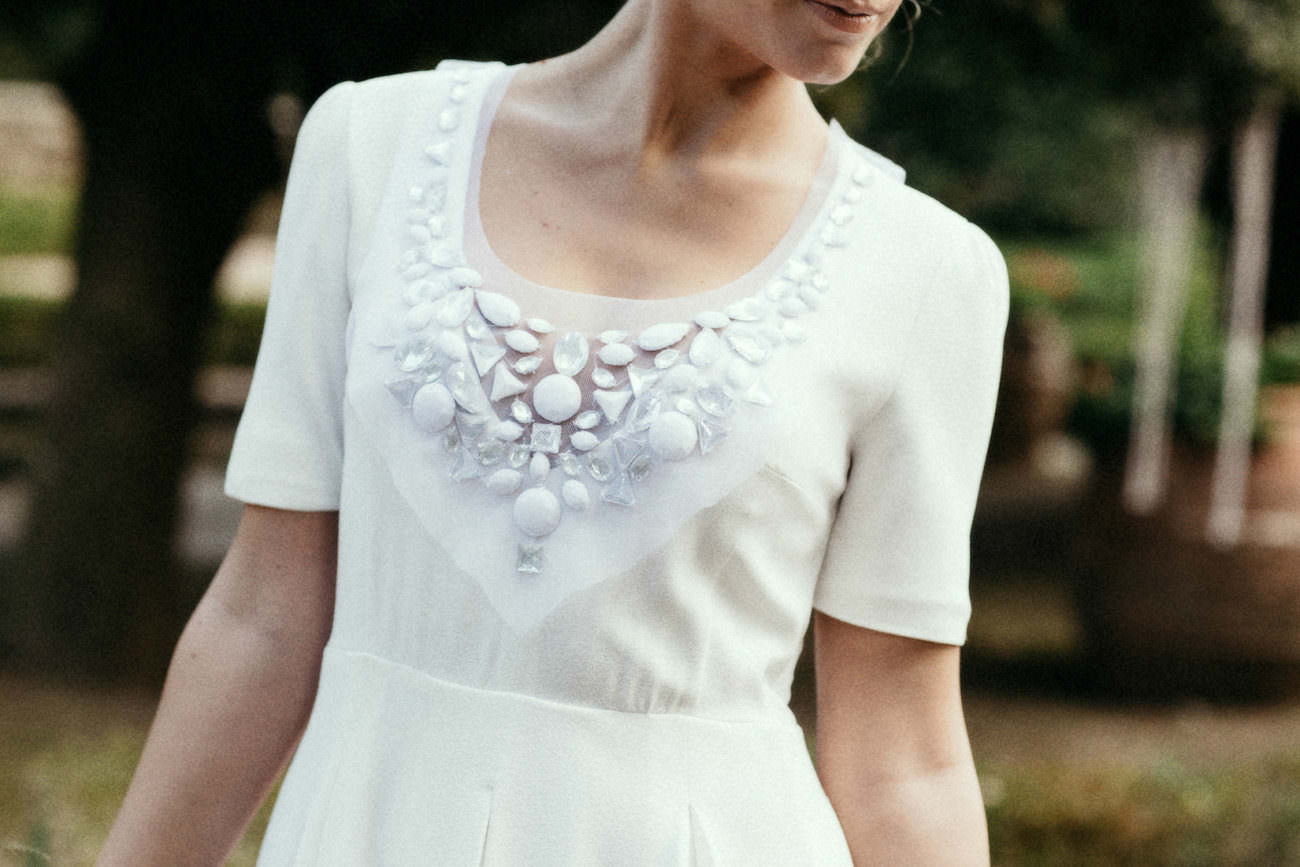 Style Shoot in Tuscany, Italy bride in wedding dress with beading detail.
