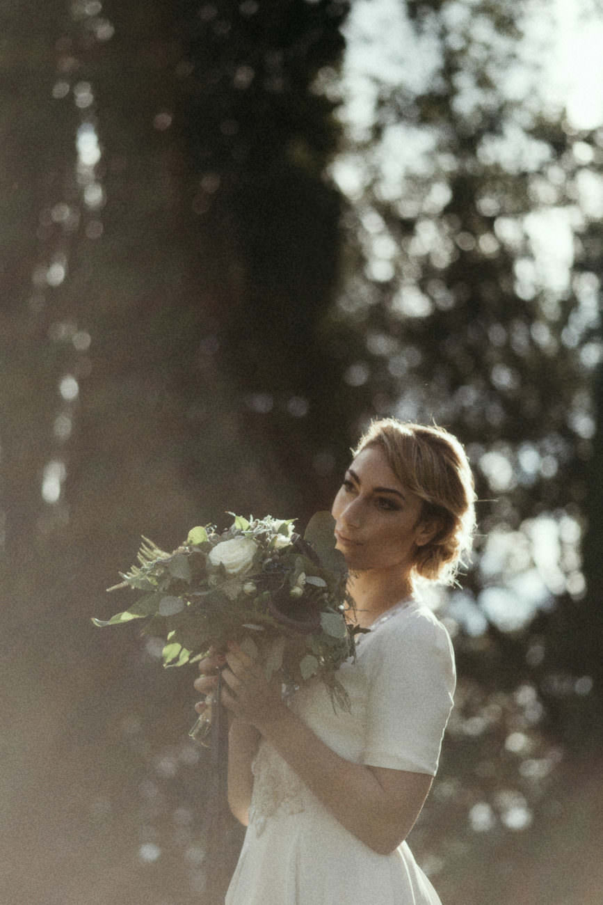 Style Shoot in Tuscany, Italy bride with flowers in the garden