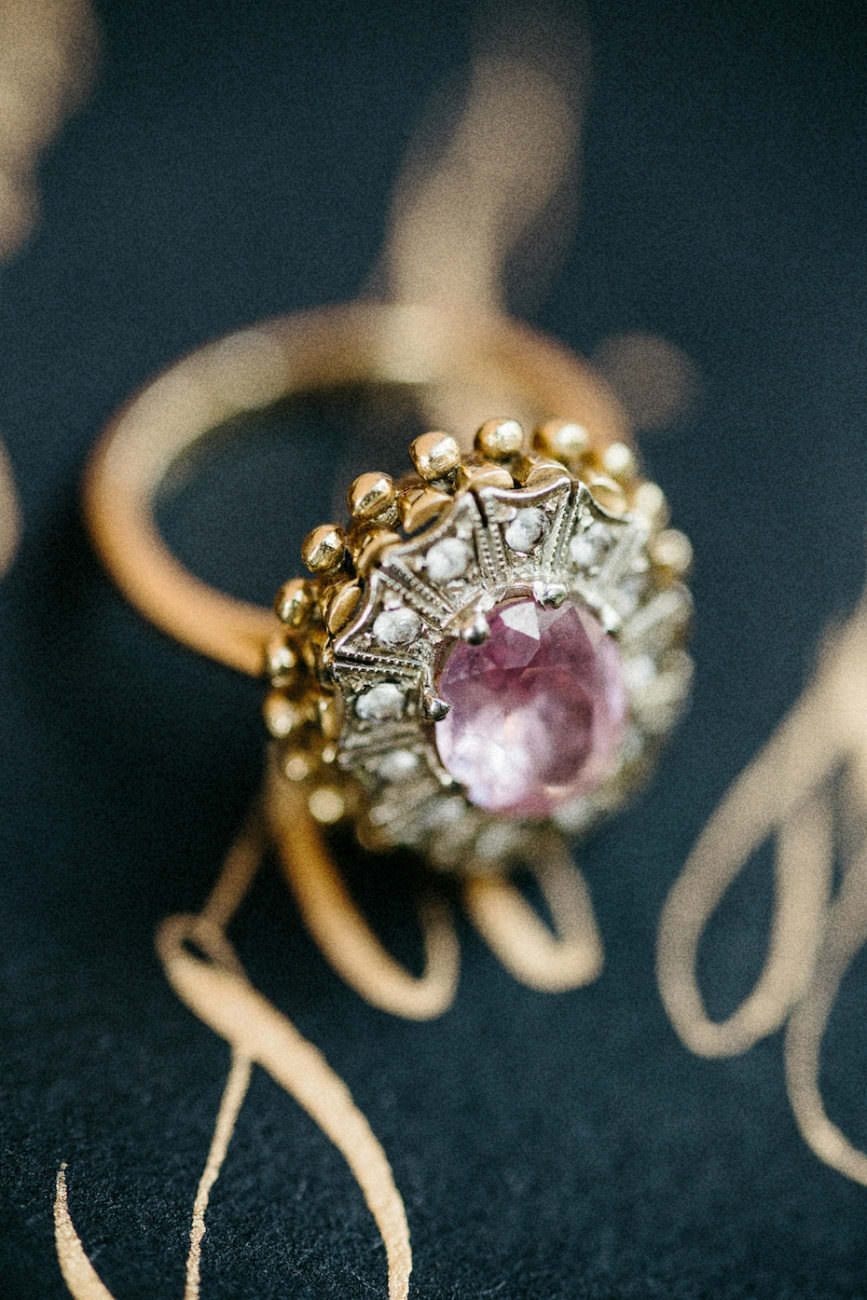 Style Shoot in Tuscany, Italy gold calligraphy close up with ring