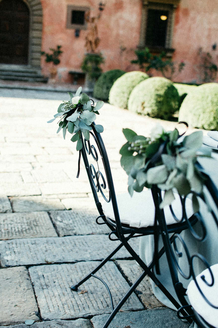 Style Shoot in Tuscany, Italy wedding chair idea with leaves