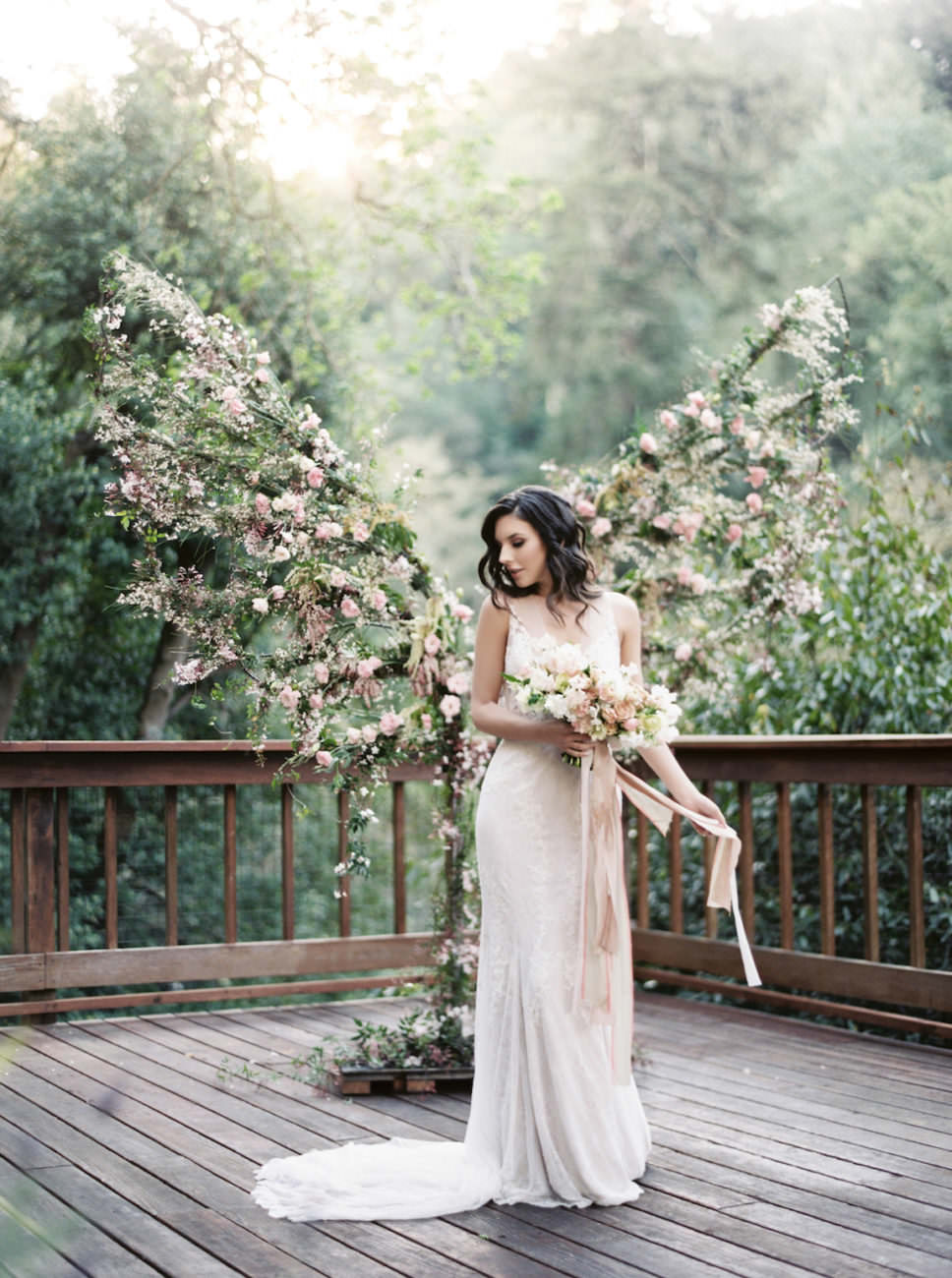 Neutral Wedding Inspiration_bride holding bouquet with ribbons