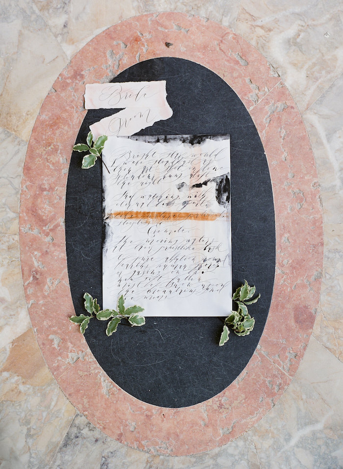 Vizcaya Wedding Inspiration with fine art calligraphy photographed on a marble tiled floor