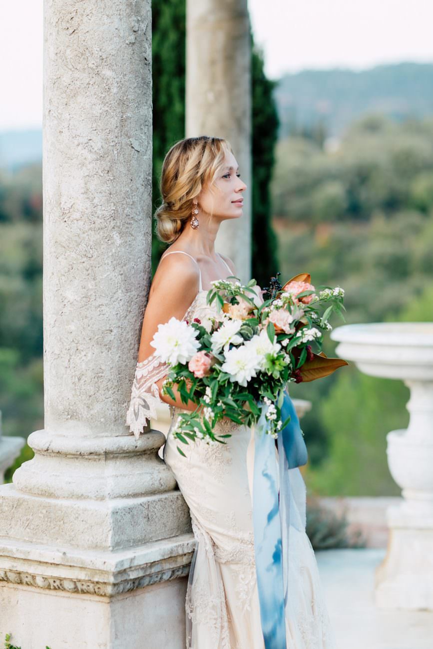 French Wedding Inspiration Bride with bouquet under gazebo close up