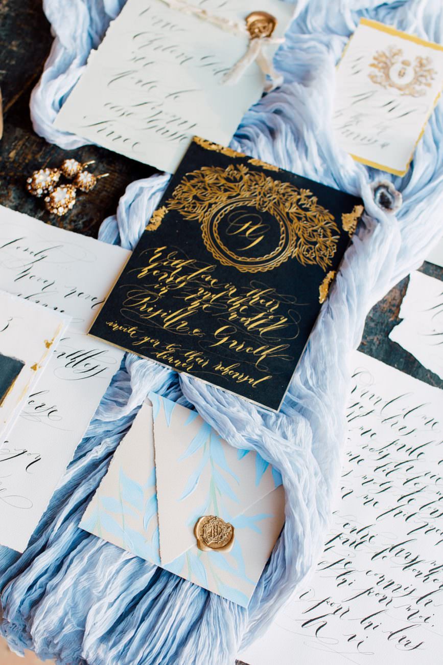 French Wedding Inspiration black wedding invitation with blue envelope