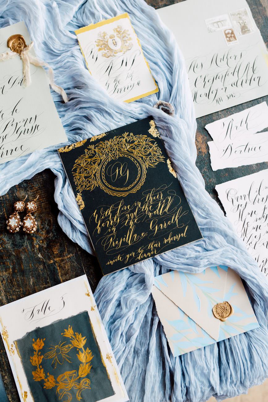 French Wedding Inspiration black wedding stationery with gold foil with envelope