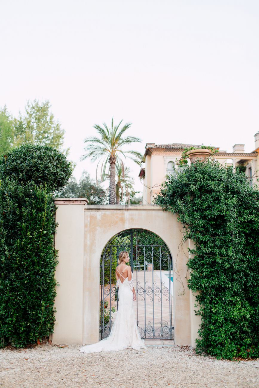 French Wedding Inspiration bride opening gates