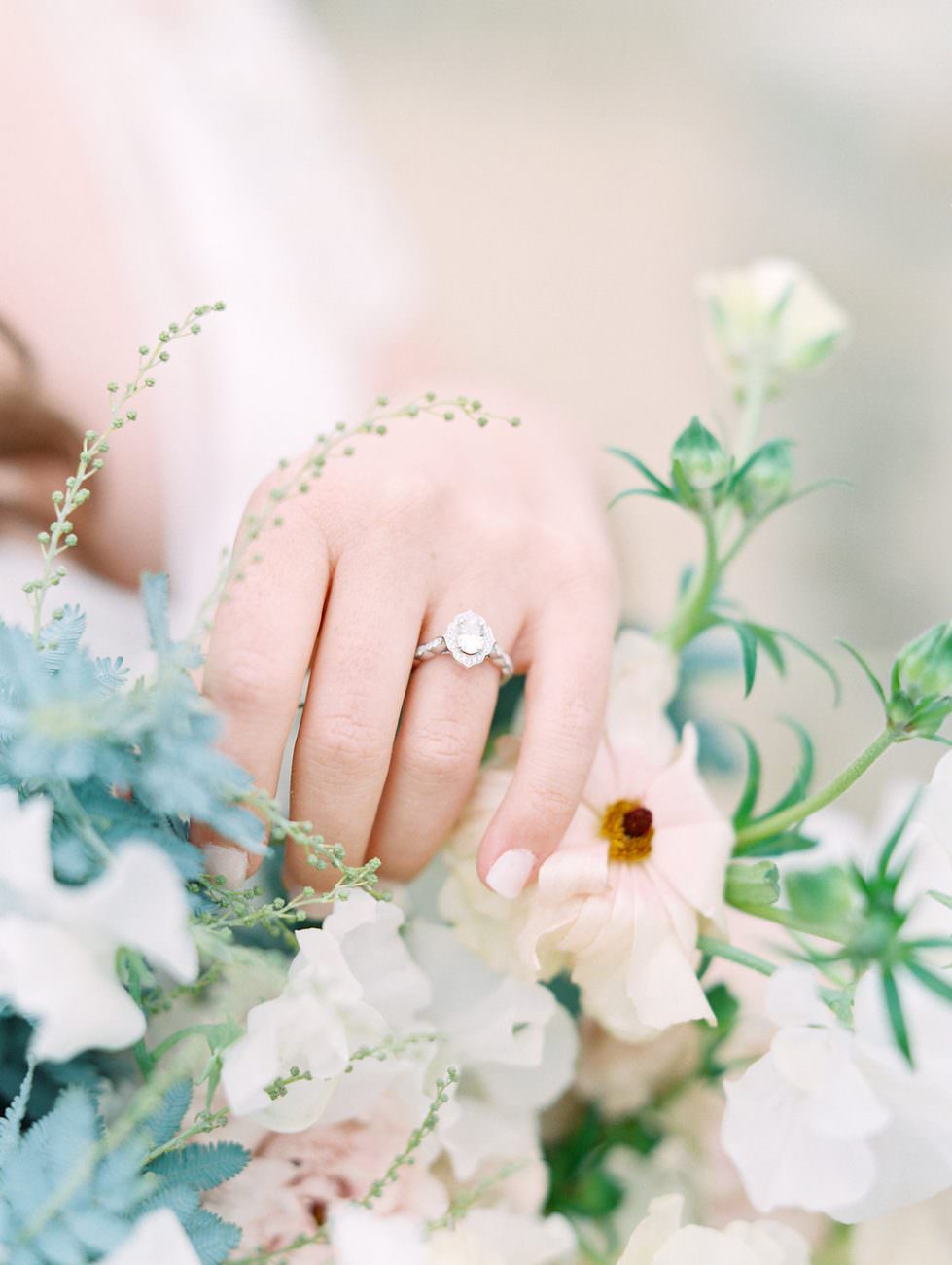 Orange Country wedding inspiration bride with ring and flowers