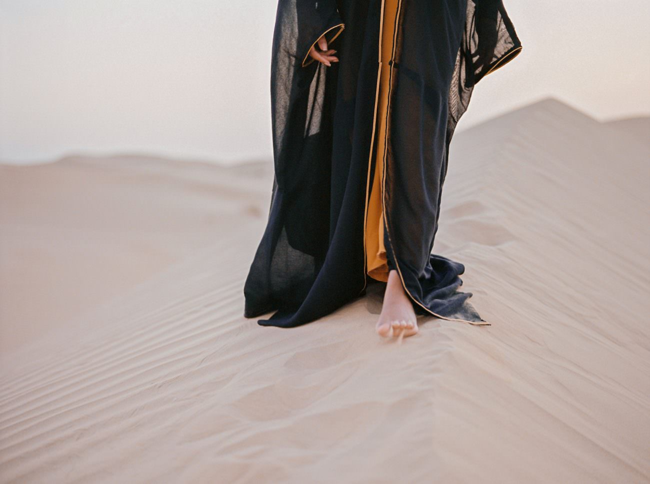 Desert fine art wedding inspiration black robe