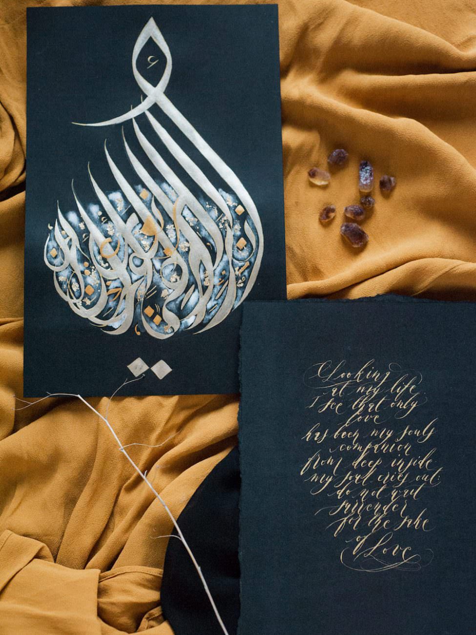 Desert fine art wedding inspiration gold Arabic calligraphy art stones
