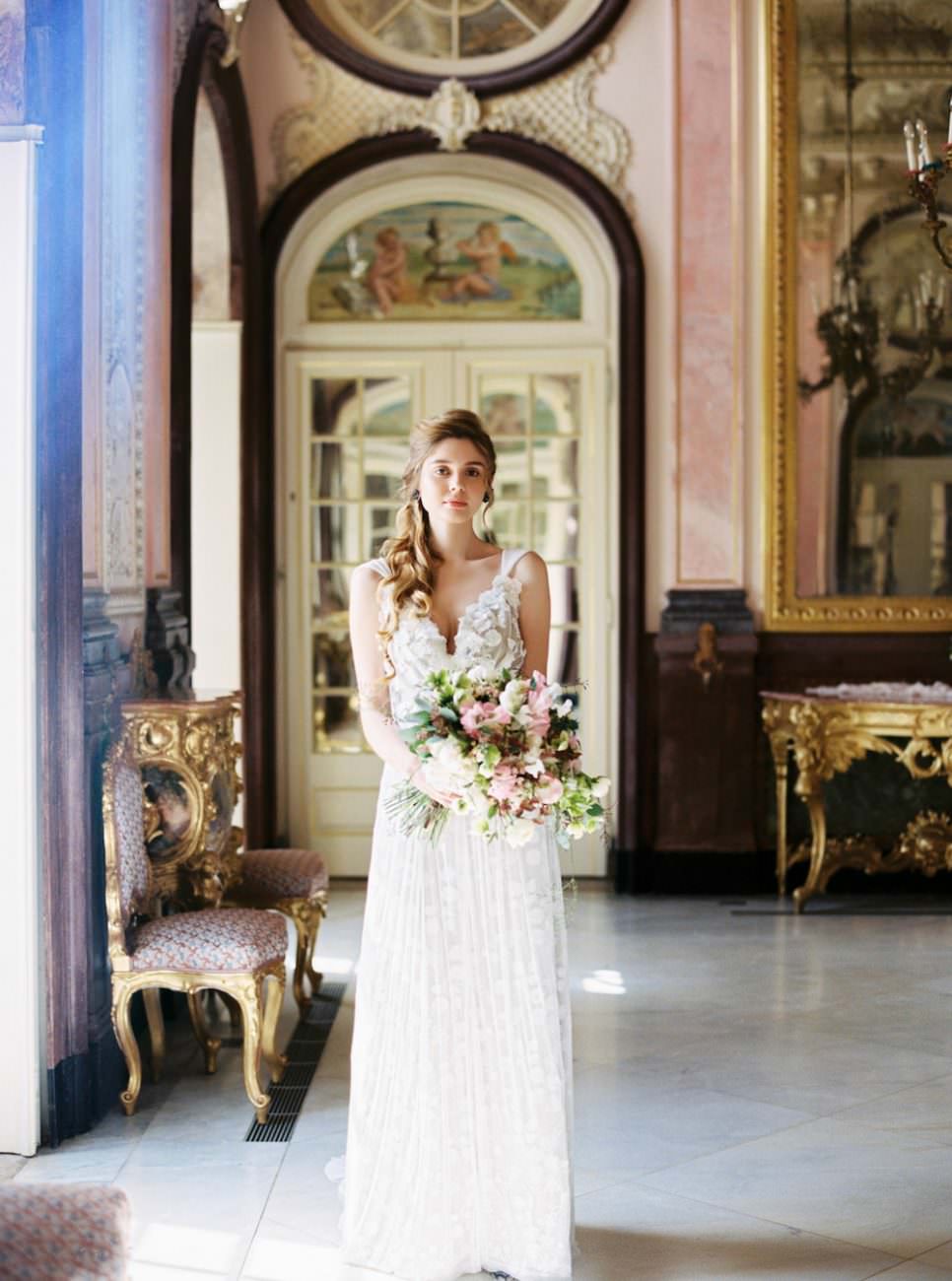 Palace Wedding Inspiration bride next to window