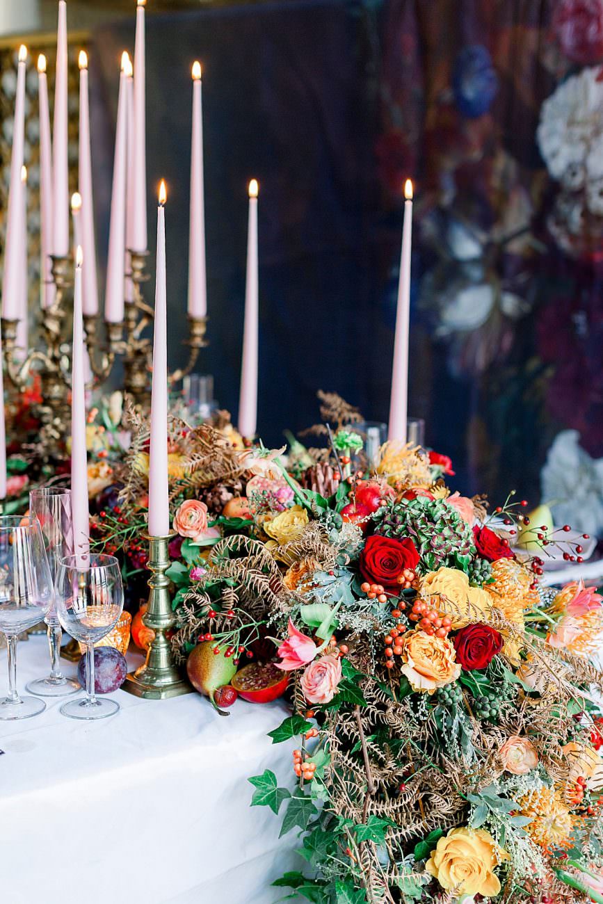 Baroque Wedding table edge with large flowers arrangement with red and yellow roses