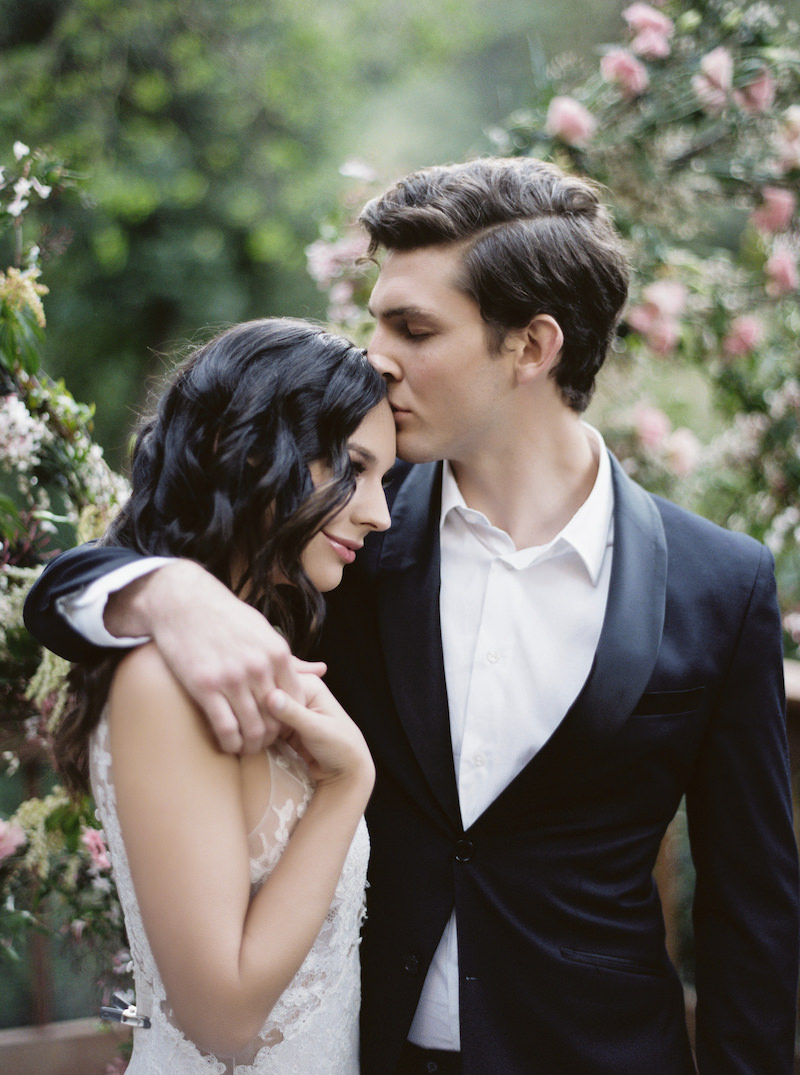 Recently engaged couple embracing and holding hands