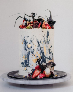 luxury wedding cake designers textured icing with gold foil and fruit