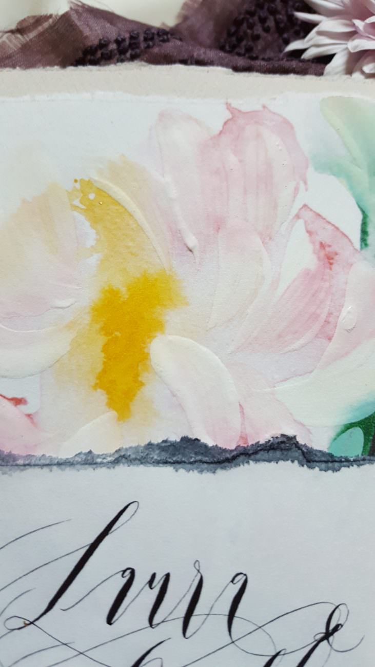 Hand Painted Wedding Invitations close up of a painting