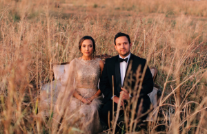 Rich Red & Gold Autumn Wedding furniture seated in a field copy