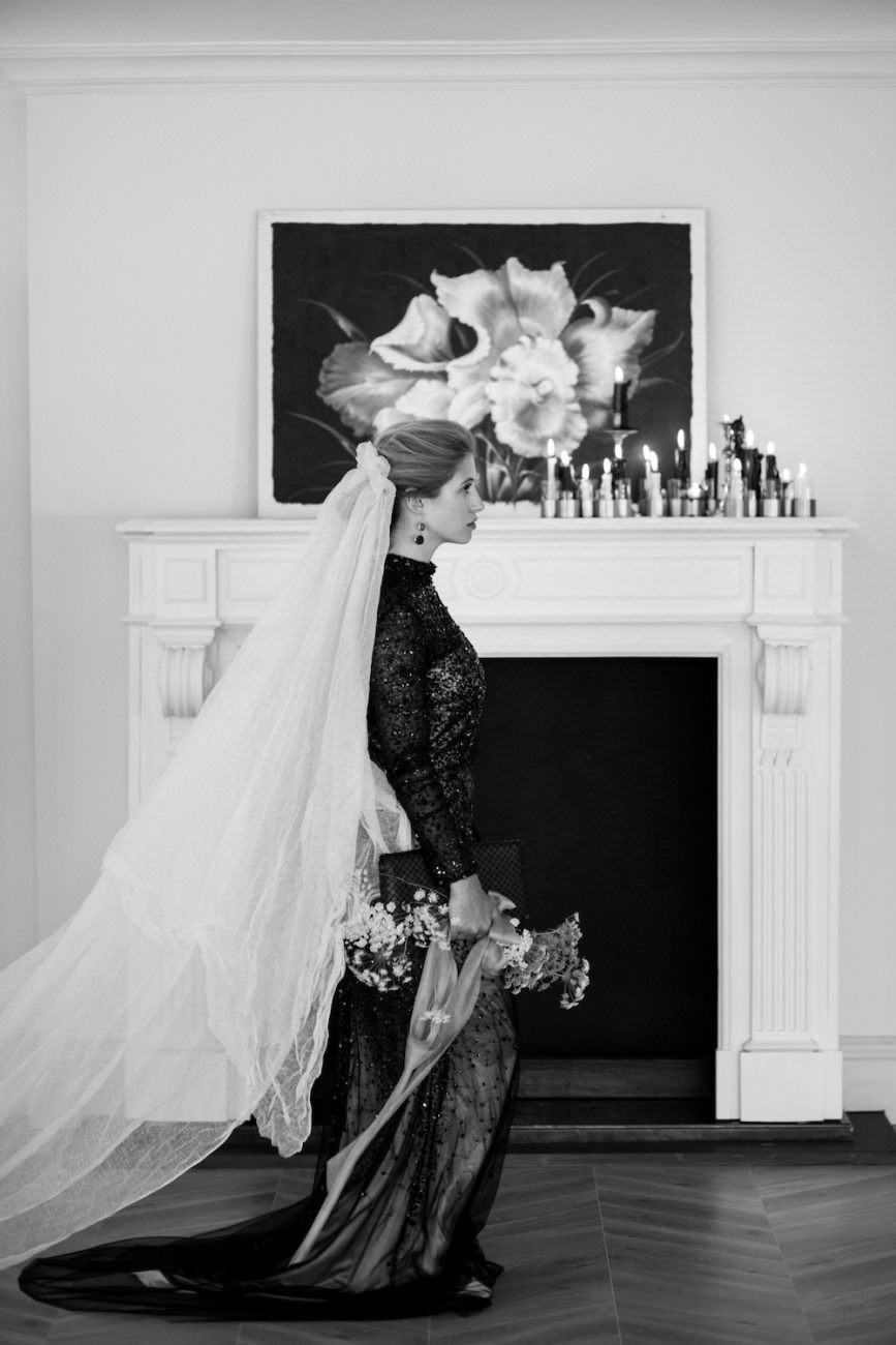 Fine Art Black Tie Wedding Inspiration Shoot bride walking past fireplace
