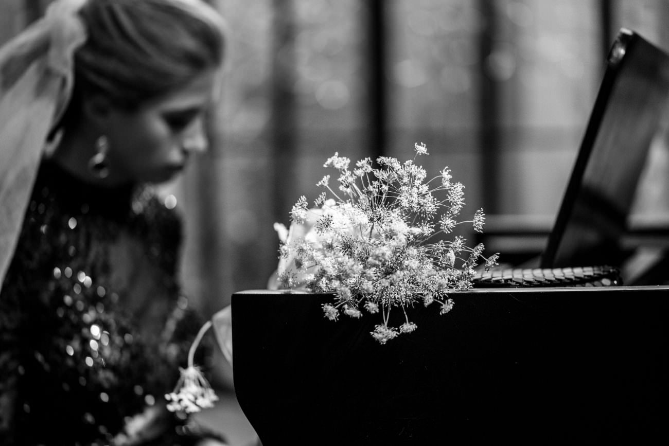 Fine Art Black Tie Wedding Inspiration Shoot with white flowers on piano