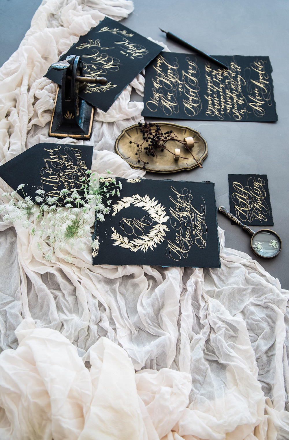 London Wedding Invitations Black Tie wedding stationery suite with gold calligraphy and floral wreath