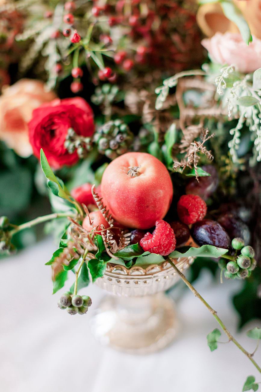 Baroque wedding inspiration with rich fruits placed onto a table setting