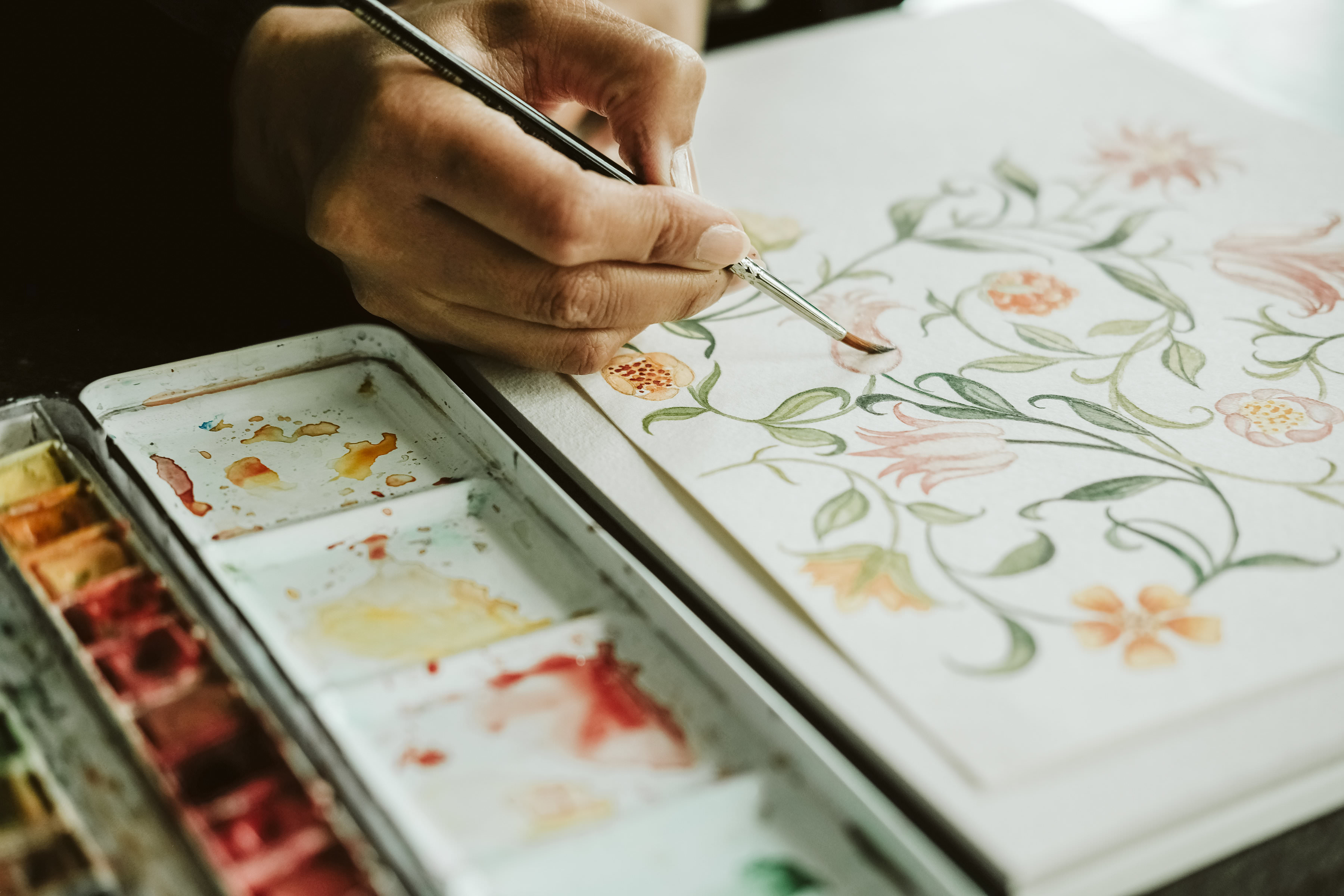 Illustrated Wedding Invitations with a floral watercolour being illustrated
