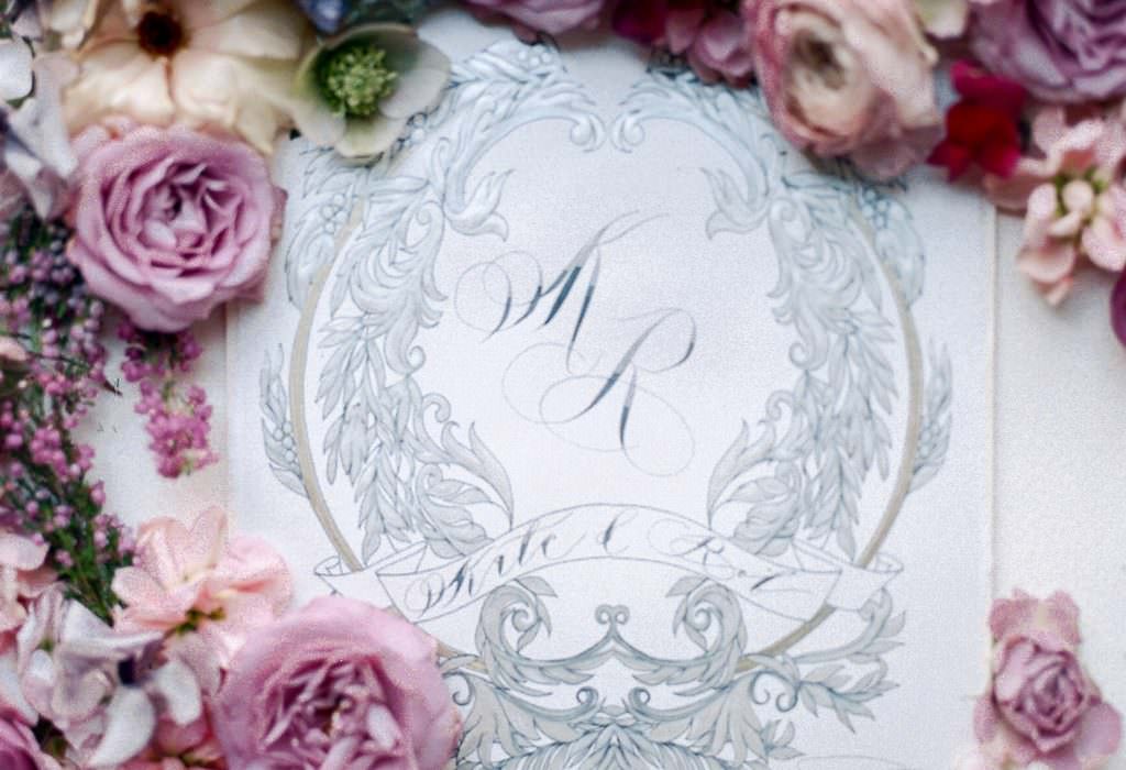 Luxury event invitations with silver crest design