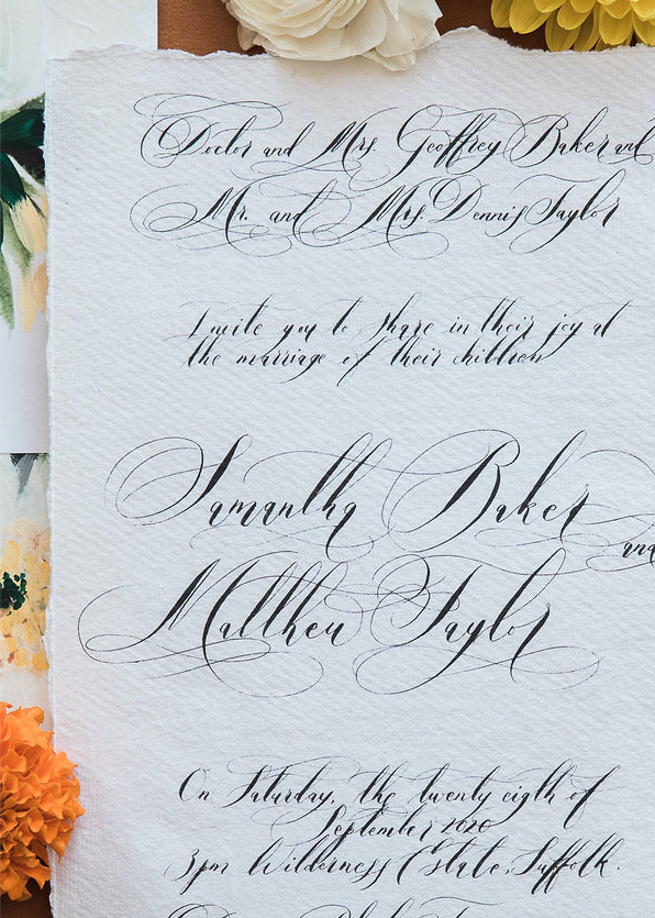 Black calligraphy on hand made white paper for a love letter style invitation