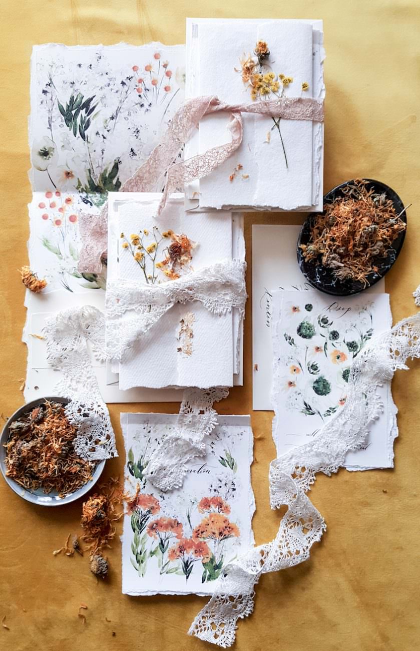 Hand made paper watercolour wedding invitations with crochet ribbon for fine art wedding stationery