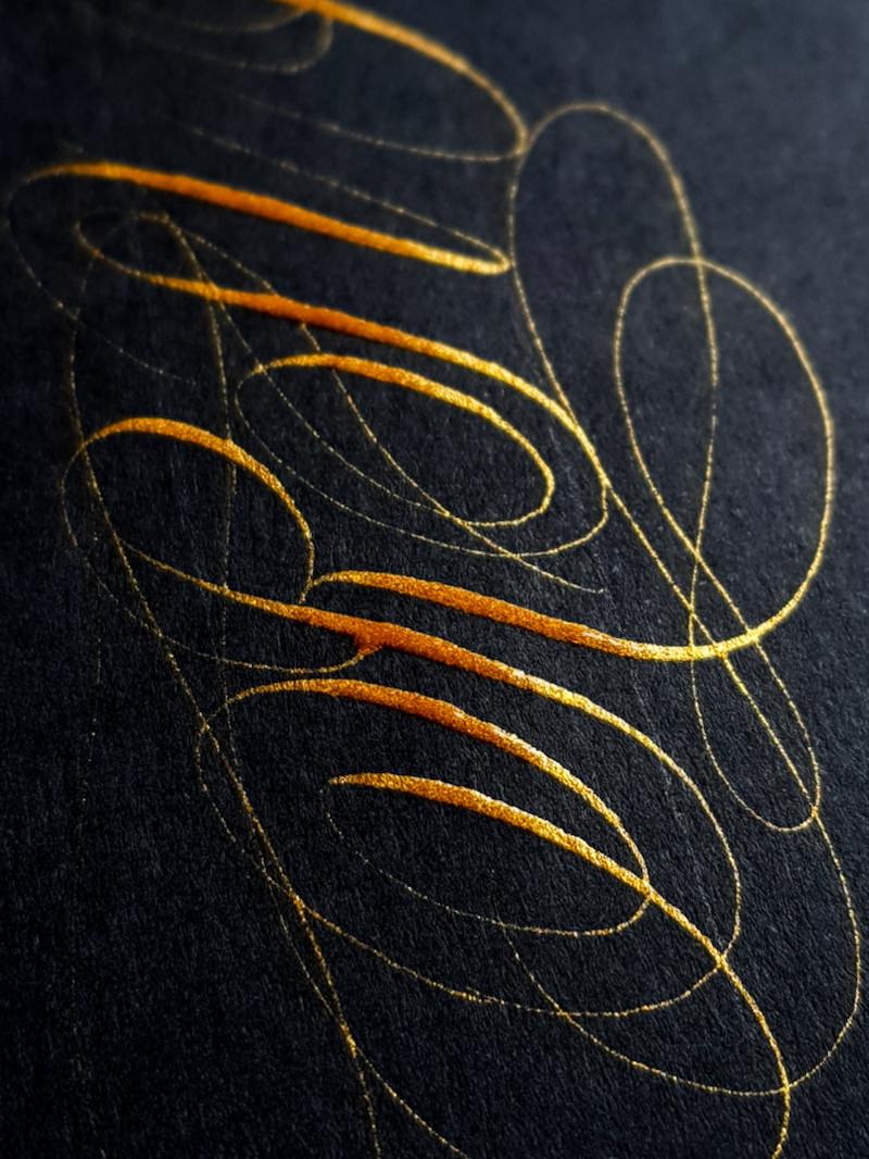 Gold calligraphy on black paper