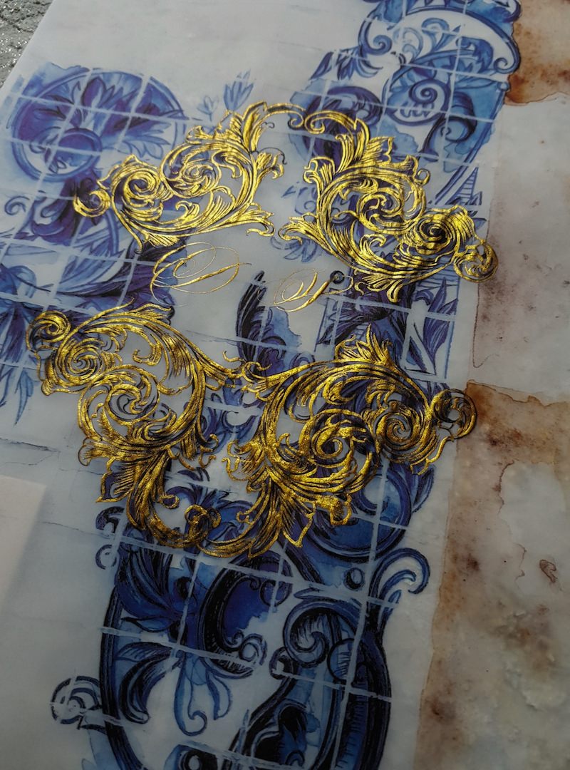 Deep blue azulejos watercolours with gold crest design and monogram