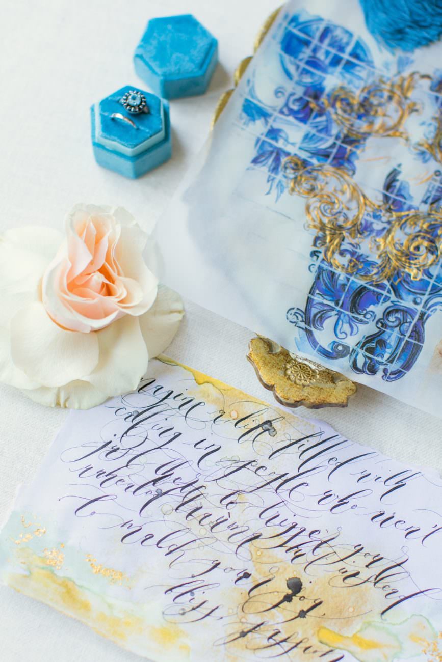 Destination wedding invitations with classical blue Azulejos inspired vellum statement piece with black calligraphy poem