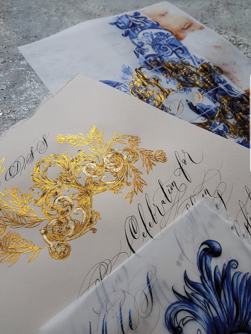 Destination wedding invitations with rich blue, cream and gold accents