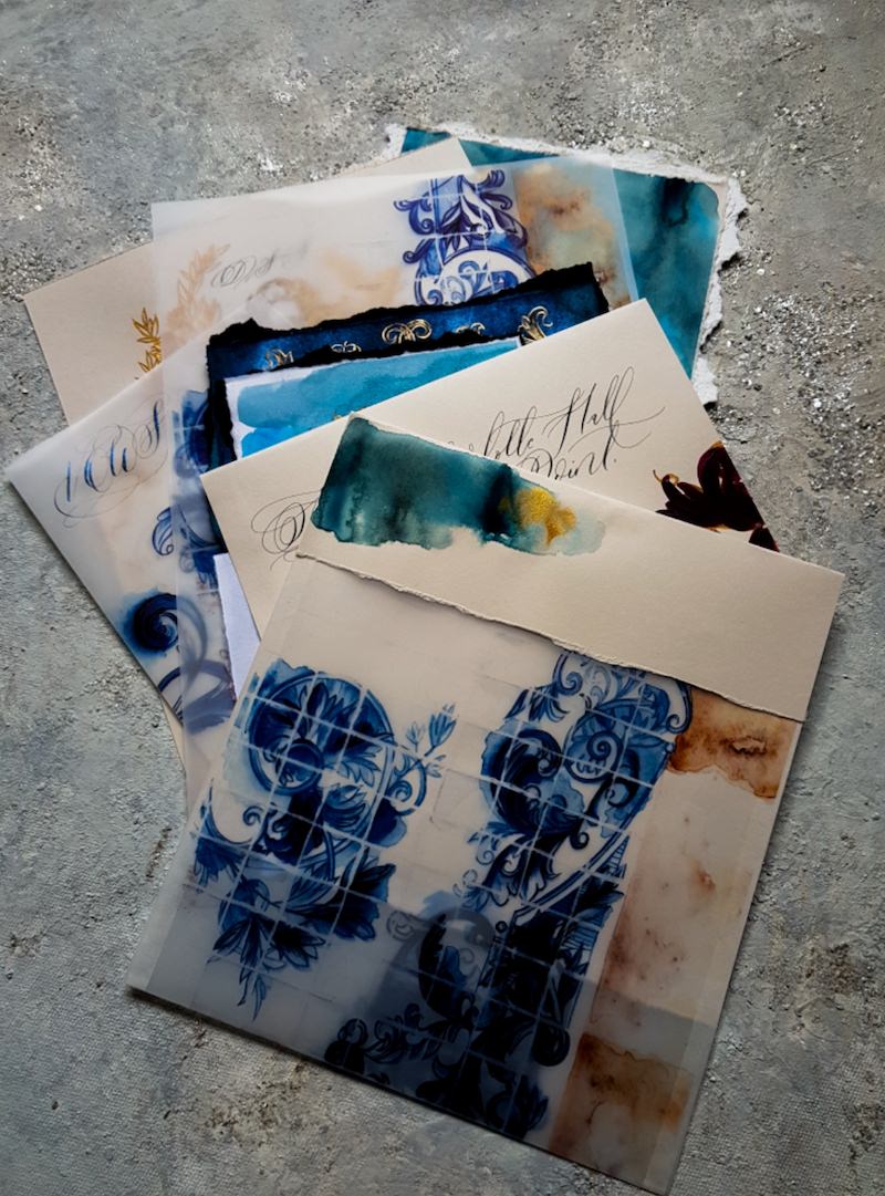 Hand painted wedding stationery suite with illustrated navy blue, teal and gold watercolour designs for a luxury destination wedding in Portugal